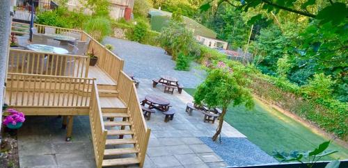 an overhead view of a patio with tables and benches at Holland arms hotel in Llangristiolus