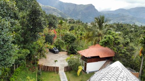an aerial view of a house in the mountains at JK Nature Stay Resorts in Kanthalloor