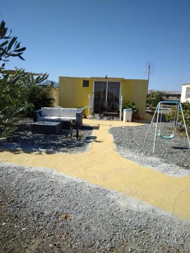 a yard with a playground and a house at MERSINERA PARADISE GARDEN STARS HOUSE in Larnaka
