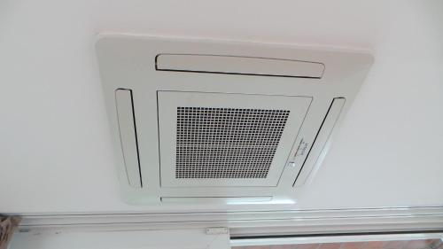 a microwave oven in the ceiling of a room at Galerius Harmony Penthouse in Siófok