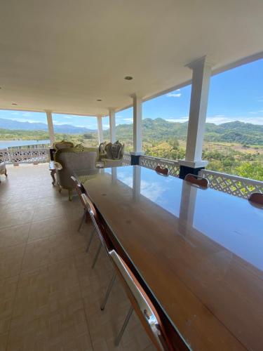 a viewing deck of a cruise ship with a view of the water at Hakata Lejja near Natural Hot spring in Batu-Batu