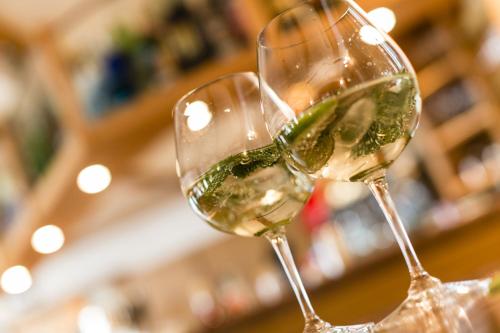 two glasses of white wine in a store at DAS BADL - Smart Retreat AO in Caldaro