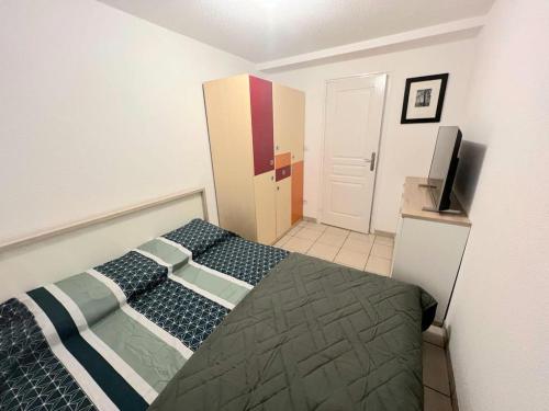 Ein Bett oder Betten in einem Zimmer der Unterkunft Strategico bilocale tra Hegenheim FR / Allschwil CH