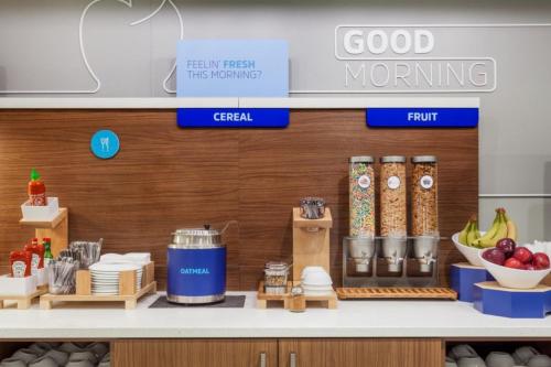 a kitchen with a counter with food on it at Holiday Inn Express & Suites Lima by IHG in Lima
