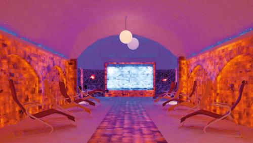 a room with chairs and a purple ceiling at Gasthof Post in Dalaas
