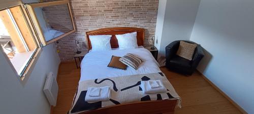 a bedroom with a bed in a small room at La Reine-des-prés in Vernamiège