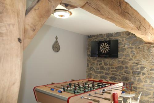 a room with a large chess board on a wall at Le grenier de la Floye in Biesmerée