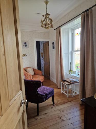 Postel nebo postele na pokoji v ubytování Isla Rose Cottage