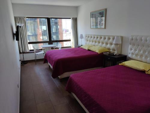 Een bed of bedden in een kamer bij Buenos Aires Center Apart