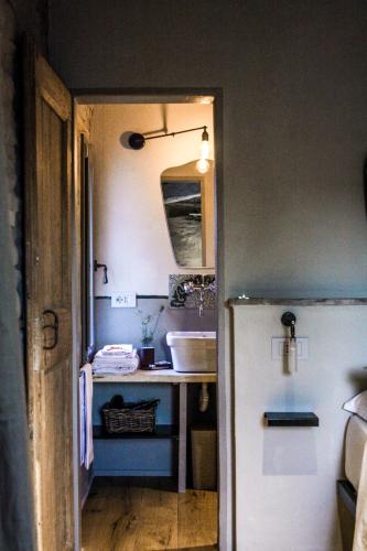 a kitchen with a sink and a refrigerator at Bnb Verdeolivo in Coriano