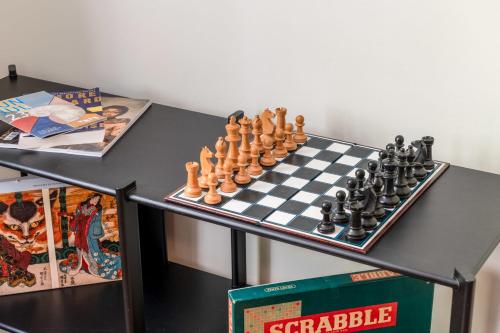 a chess board and chessboard set on a table at Stylish Kings Cross Flat in London