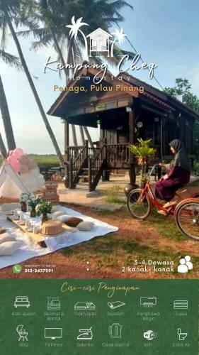 una persona montando una bicicleta delante de una casa en Kampung Cheq Homestay - Private Pool, Free Wifi, Netflix en Penaga