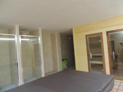 a room with two sliding glass doors in a room at Las Abadías in San Felices