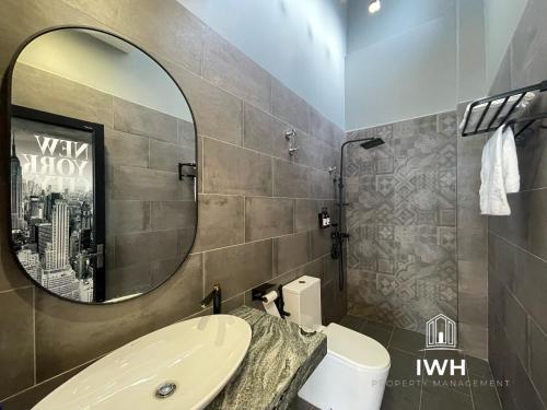 a bathroom with a sink and a mirror at Ipoh 19A Villa for 12pax 6 Carpark with BBQ by IWH in Ipoh