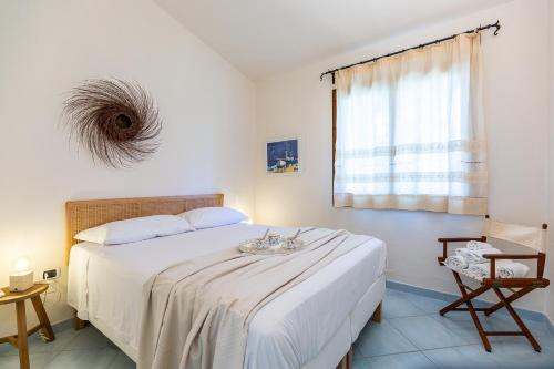 Кровать или кровати в номере Patio Relax - 200m from beach - Villasimius
