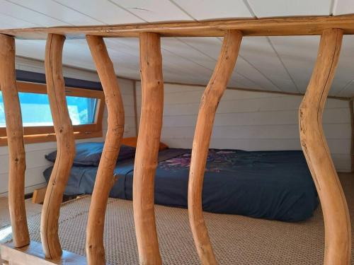Postel nebo postele na pokoji v ubytování Tiny House de la Côte Roannaise