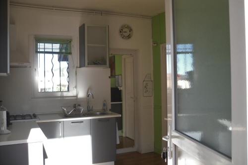 a kitchen with a sink and a counter top at Calme & Indépendance in Lourdes