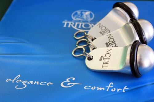 a bottle of wine on a key chain at Triton Hotel Piraeus in Piraeus