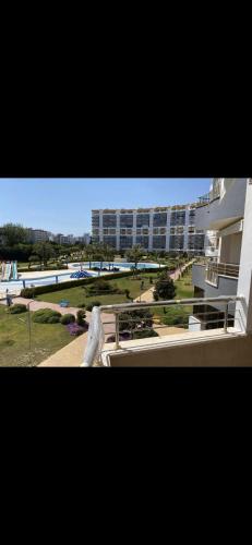 a view of a large building and a park at Queenaba tatil sitesi in Mersin