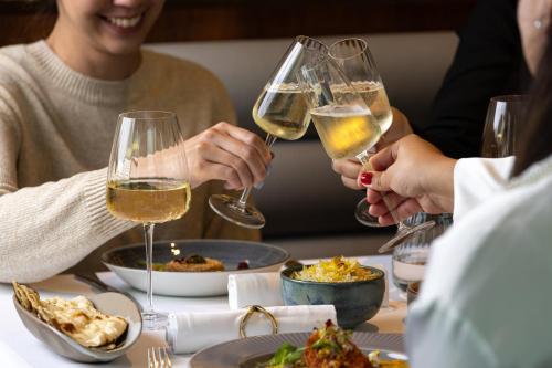 a group of people sitting at a table with wine glasses at InterContinental London - The O2 in London