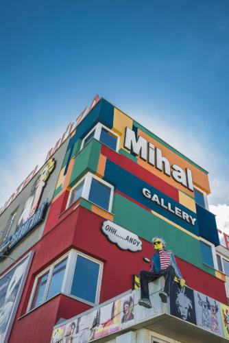a building with a mural on the side of it at Hotel Muza in Košice