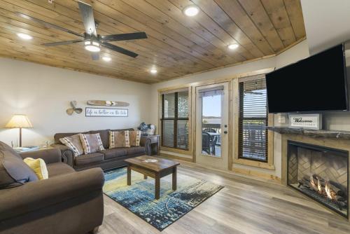 a living room with a couch and a fireplace at Table Rock Resorts at Indian Point in Branson