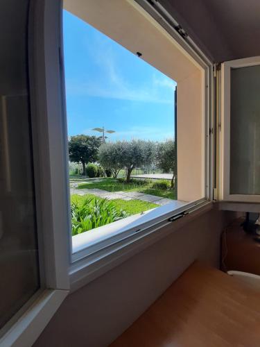 a window in a room with a view at Nice apartments lake view & free parking in Pastrengo
