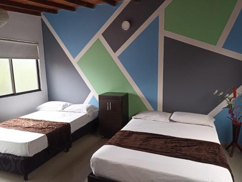Postel nebo postele na pokoji v ubytování 33 Hotel Bulerias