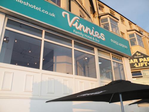 an umbrella sitting in front of a building at Vinnie's Family Hotel in Blackpool