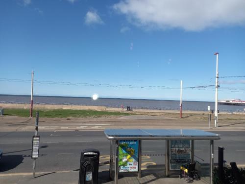 a bus stop on the side of a street at Vinnie's Family Hotel in Blackpool