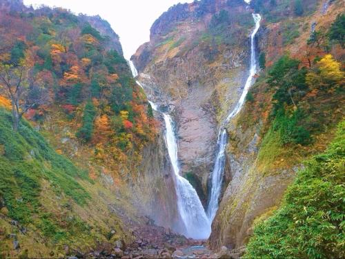 a waterfall on the side of a mountain at ANA Crowne Plaza Toyama by IHG in Toyama