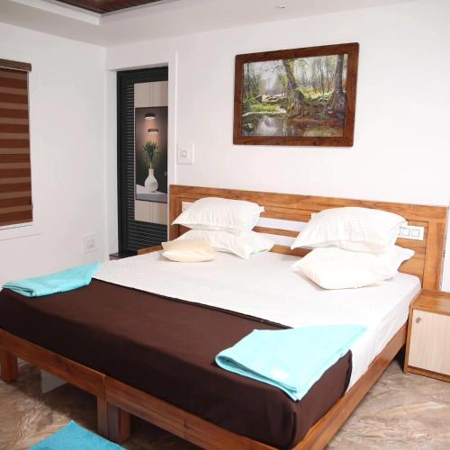 a bedroom with a large bed in a room at Bhuvanam homestay in Kalpetta