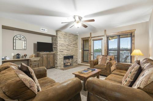 a living room with two couches and a fireplace at Table Rock Resorts at Indian Point in Branson