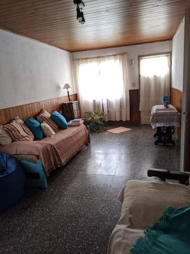 a bedroom with two beds and a window at Casa en Pigue in Pigüé