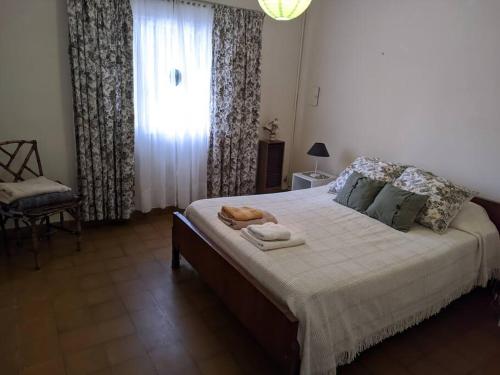 Ένα ή περισσότερα κρεβάτια σε δωμάτιο στο Casa en Pigue