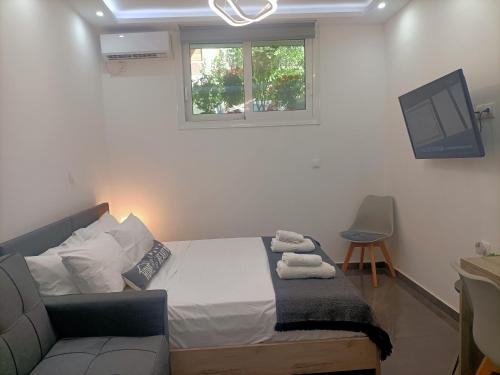A bed or beds in a room at Central Bachelor