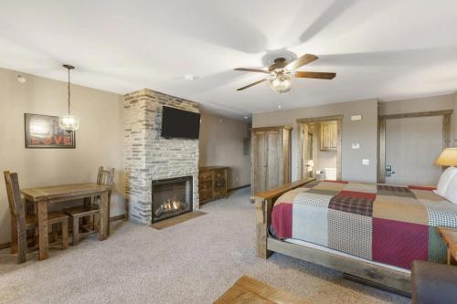 a bedroom with a bed and a fireplace at Table Rock Resorts at Indian Point in Branson