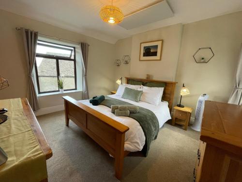 Voodi või voodid majutusasutuse Muddy Paws Cottages - The Nook toas