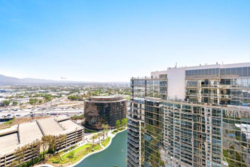 an aerial view of a city with buildings and a river at 25th floor Luxury Penthouse in Santa Ana