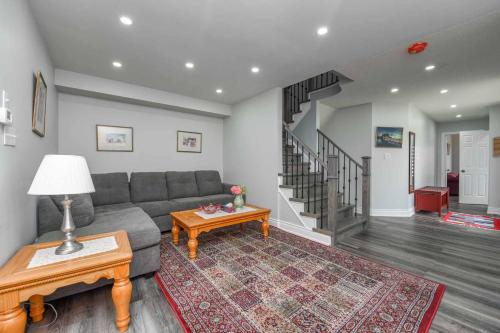 a living room with a couch and a table at Luxury Home in Mississauga in Mississauga