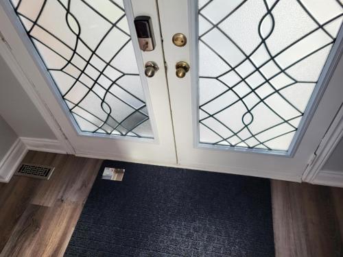 a room with a door with a glass at Luxury Home in Mississauga in Mississauga