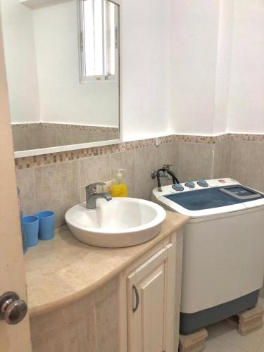 a bathroom with a sink and a counter with a stove at El Dorado Condo 208A in Punta Cana