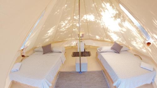 a tent with two beds in the middle of it at Panama Kite Center in Punta Chame