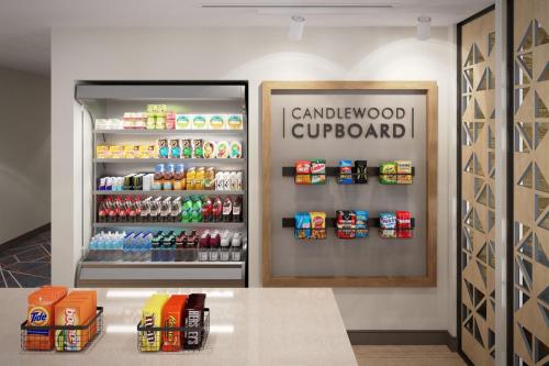 a canadian supermarket with a refrigerator filled with drinks at Candlewood Suites Atlanta - Smyrna by IHG in Atlanta