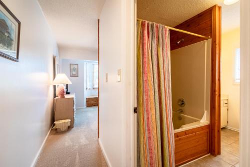 a hallway with a shower curtain in a room at 2816 - Tranquil Sound by Resort Realty in Duck