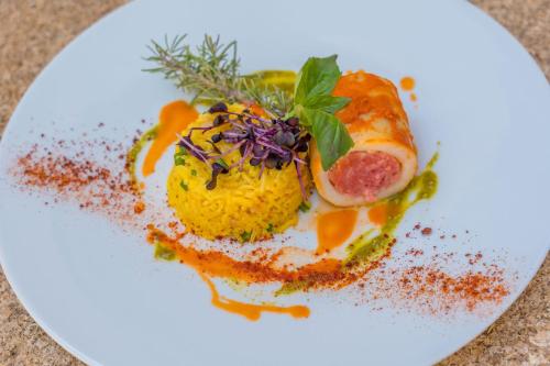 a plate of food on a white plate at Le Mas de La Crémaillère in Gréoux-les-Bains