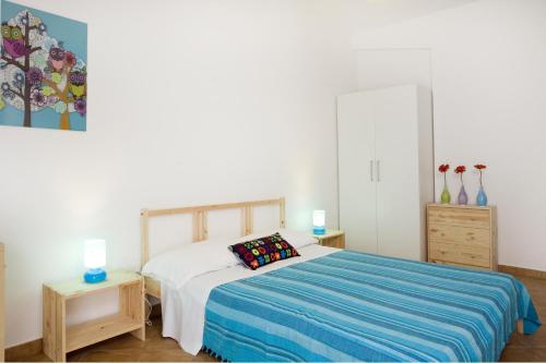 Ένα ή περισσότερα κρεβάτια σε δωμάτιο στο B&B La Gatta Bianca