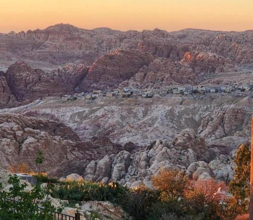 a city on top of a rocky mountain at Leen Guest House in Wadi Musa