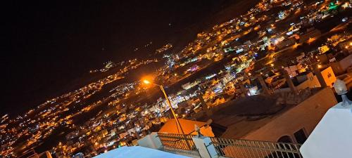a view of a city at night with a street light at Leen Guest House in Wadi Musa
