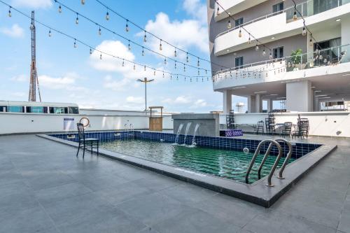 a swimming pool on the side of a building at W16 Water Front Apartments in Lekki